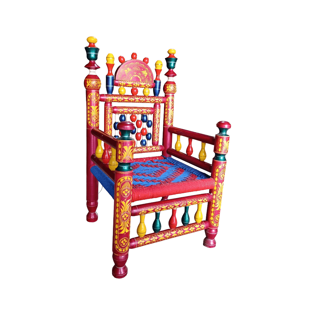 A highly decorative hand-painted wooden throne chair with red, yellow, and blue patterns, set against a plain white background.