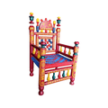 A highly decorative hand-painted wooden throne chair with red, yellow, and blue patterns, set against a plain white background.