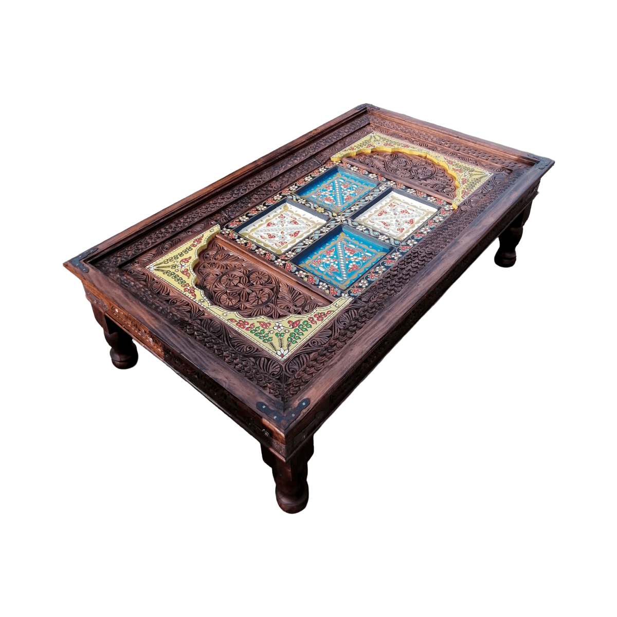 A dark brown carved wooden coffee table with a colorful mosaic tile design on the top, shown on a plain white background.